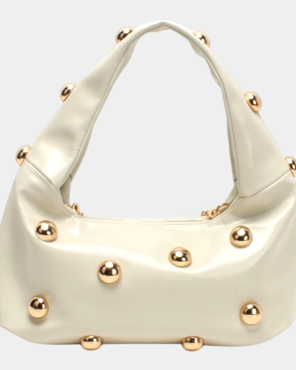 Sac à main chic couleur crème avec dorure
